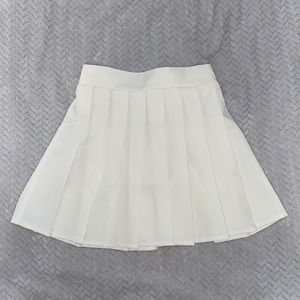 This is a cute white mini tennis skirt (never worn)!